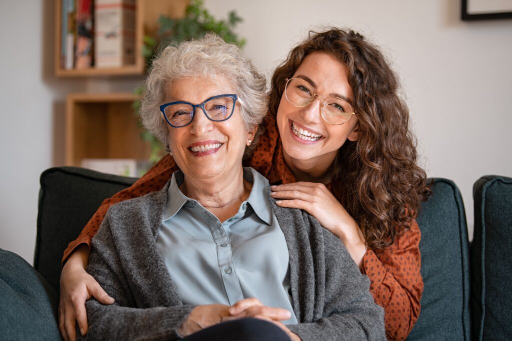 foojan app life area grandmother with her granddaughter sitting on a couch